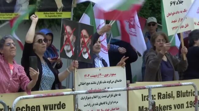 Exiled Iranians in Berlin celebrate president's death