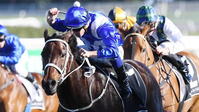 Winx ridden by Hugh Bowman (centre) wins the Bob Ingham Warwick Stakes race during the Might and Power Race Day at Randwick racecourse in Sydney, Saturday, August 19, 2017. (AAP Image/David Moir) NO ARCHIVING, EDITORIAL USE ONLY