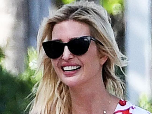 FEES APPLY - MUST SPEAK TO MEGA BEFORE USING -  PREMIUM EXCLUSIVE: Ivanka Trump wears a red coral patterned swimsuit under a matching coverup robe as she takes a walk on the beach with her daughter in Miami. 14 Mar 2021 Pictured: Ivanka Trump. Photo credit: MEGA TheMegaAgency.com +1 888 505 6342 (Mega Agency TagID: MEGA739550_004.jpg) [Photo via Mega Agency]