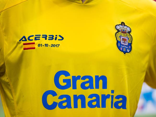 The Spanish flag and the date of the independence of Catalonia referendum is seen in the shirt of Ximo Navarro of Las Palmas during the La Liga match. Picture: Alex Caparros/Getty Images