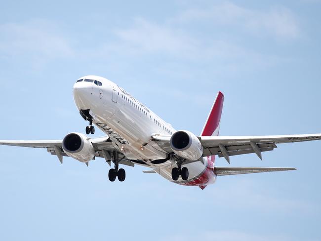 A Qantas 737 commercial passenger jet flies into Cairns Airport in Far North Queensland, bringing tourists and tourism dollars into the region. Picture: Brendan Radke