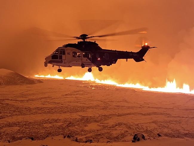 A chopper flies above the Reykjanes peninsula. Picture: Icelandic Coast Guard/AFP