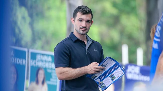 Murder-accused councillor Ryan Bayldon-Lumsden handing out how to vote material at Arundel State School. Picture: Glenn Campbell