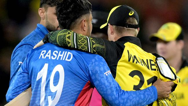 Afghanistan's Rashid Khan with David Warner during the T20 World Cup. Picture: Brenton EDWARDS / AFP