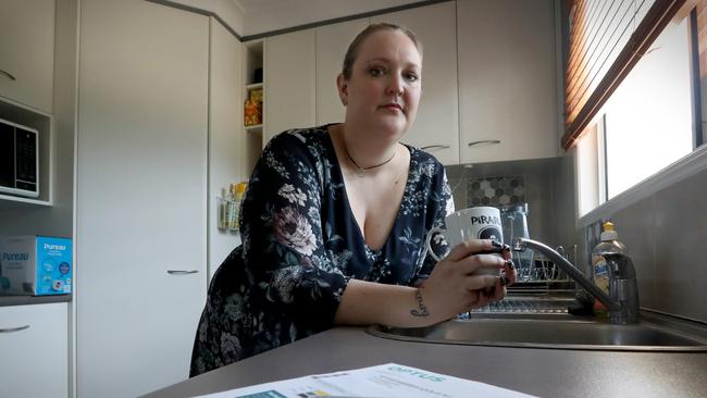 Mother-of-three Rebecca Allen, 32, is hoping to get rid of credit card debt in 2020. She maxed out three credit cards totalling $16,000. Picture: Jamie Hanson.