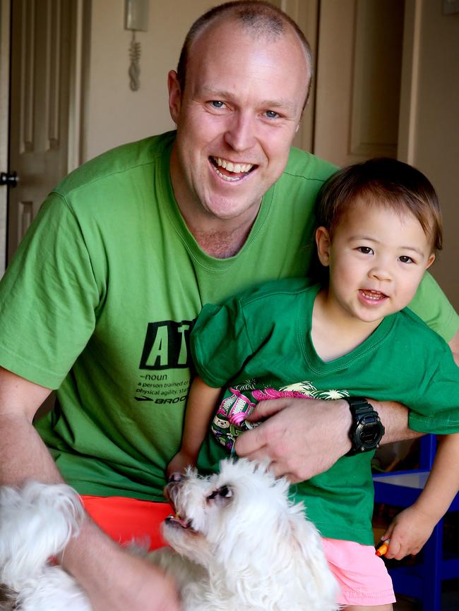 Lachlan Clyne with daughter Matilda and dog Teddy. Picture: AAP/Dean Martin