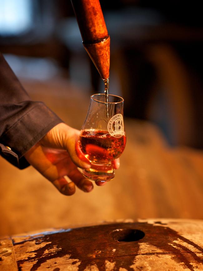 Pouring a sample of at the Bruichladdich Distillery, Isle of Islay, Scotland. Picture: Alamy