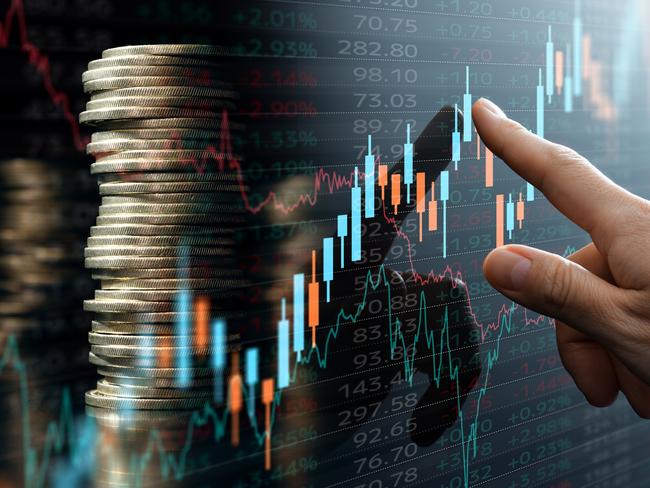 Analyst pointing candlestick chart; investing compound interest generic