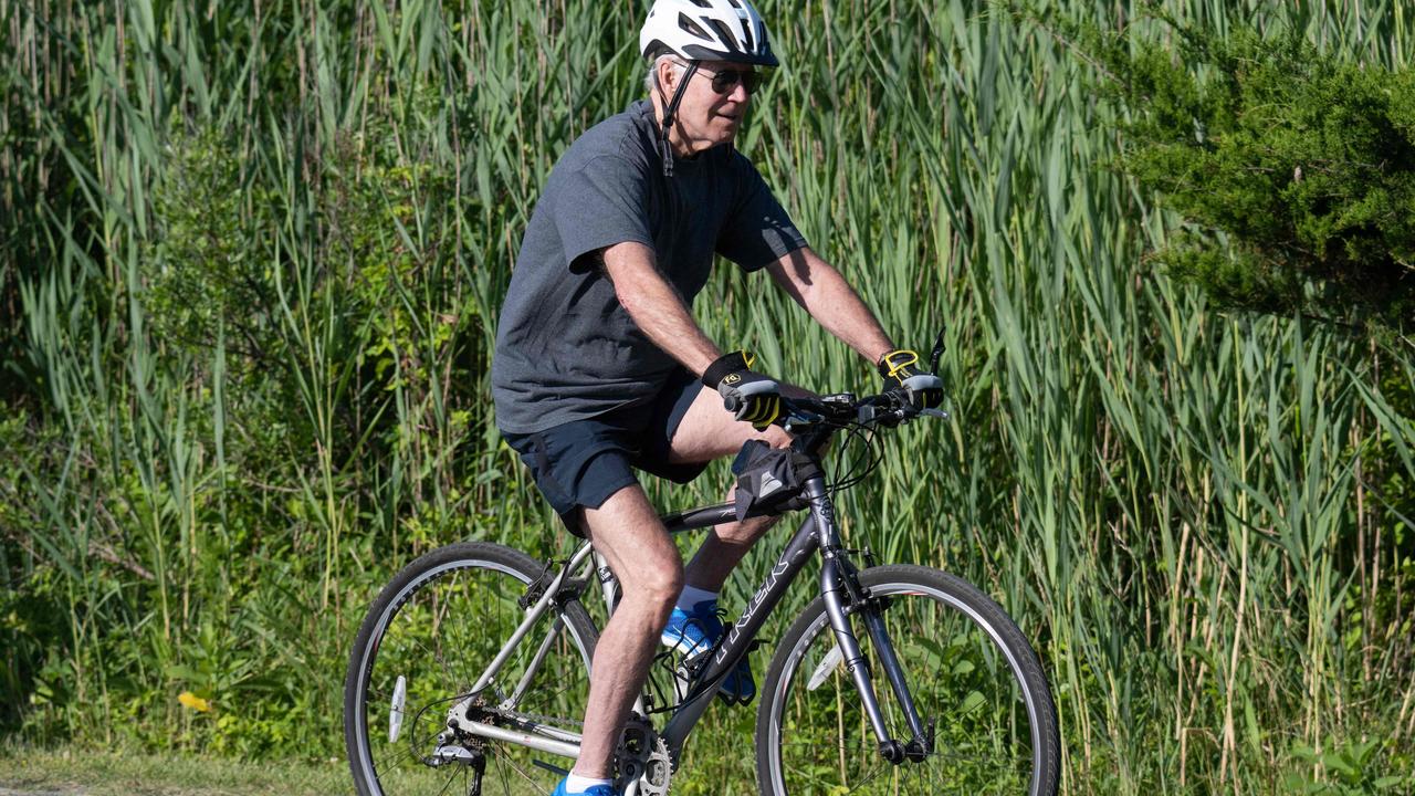 US President Joe Biden rides his bicycle at Gordon's Pond State Park in Rehoboth Beach, Delaware. Picture: Saul Loeb/AFP