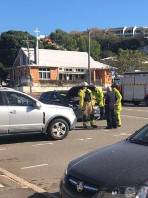 Fire crews assess a car involved in the crash.