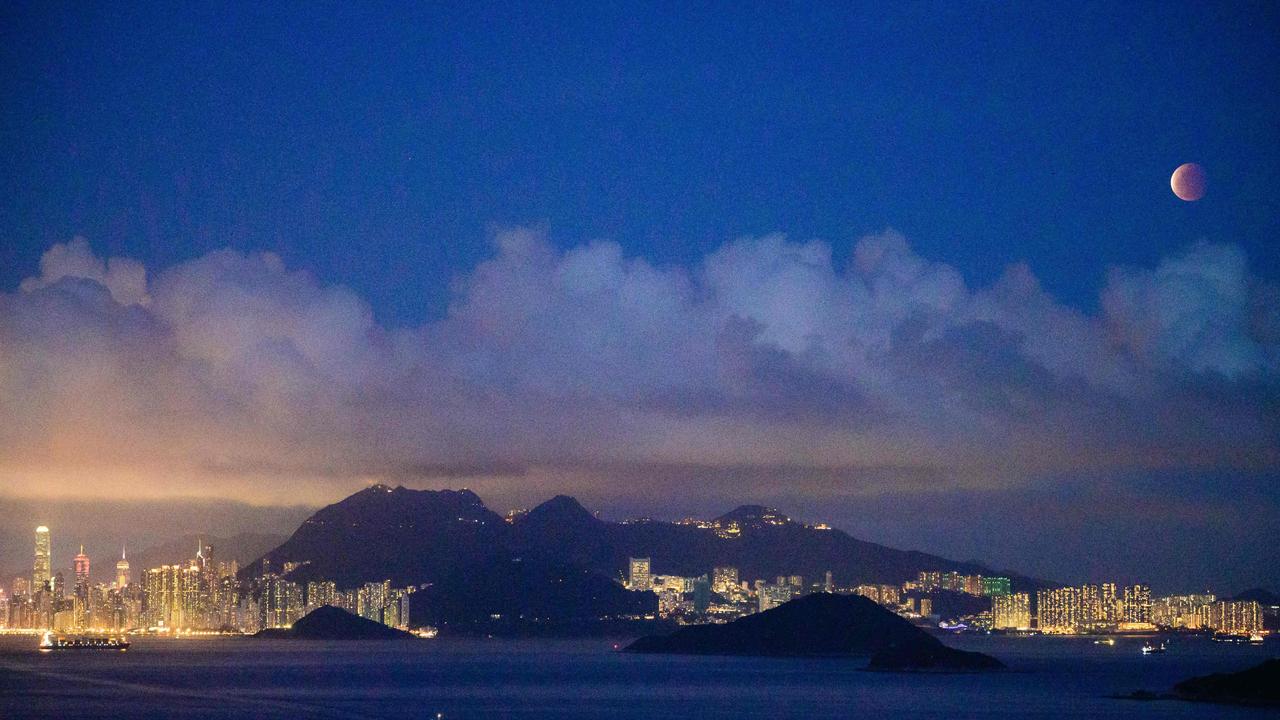 The moon is pictured above Hong Kong. Picture: AFP