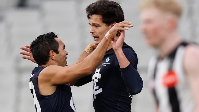 Jack Silvagni enjoys a goal with Eddie Betts.