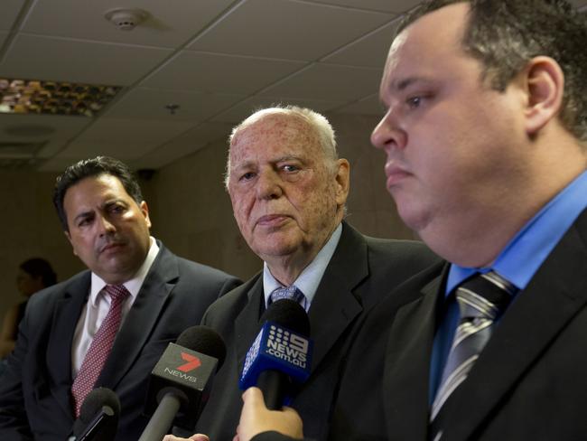 Eduardo Mayr, centre, speaks to journalists with fellow lawyers Mauricio Eduardo Mayr, right, and Anderson Rollenberg. All represent Marcelo Santoro in Rio de Janeiro. Picture: AP