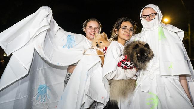 Trick or treating as ghosts are (from left) Haylee Galvin holding Daisy, Amelia Achilles holding Chewi and Leea Laurie on Halloween in Wilsonton, Sunday, October 31, 2021. Picture: Kevin Farmer