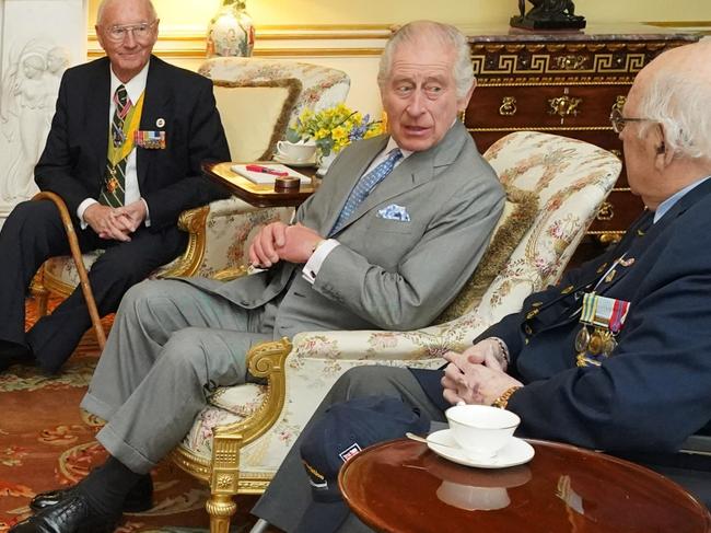 LONDON, ENGLAND - MARCH 19: King Charles III (2nd R), along with Master of The King's Household, Vice Admiral Sir Tony Johnstone-Burt (3rd L) during an audience with Veterans of the Korean War (L-R) Alan Guy, Mike Mogridge, Brian Parritt and Ron Yardley at Buckingham Palace on March 19, 2024 in London, England. (Photo by Jonathan Brady - WPA Pool/Getty Images)