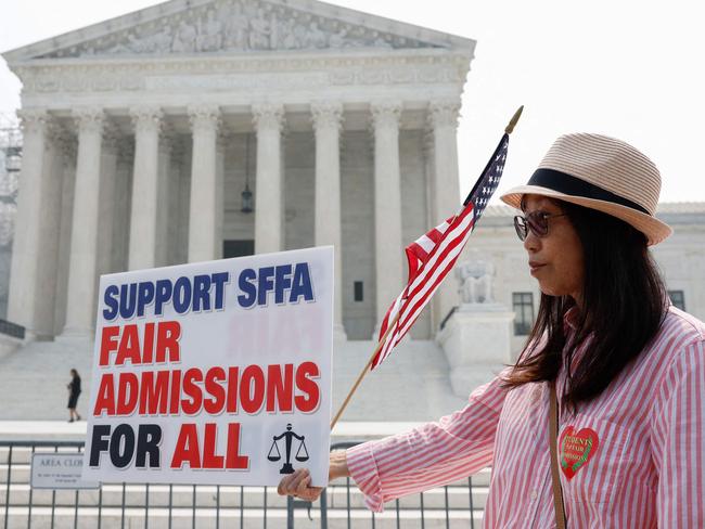 WASHINGTON, DC - JUNE 29: Anti-affirmative action activists with the Asian American Coalition for Education protest outside the U.S. Supreme Court Building on June 29, 2023 in Washington, DC. In a 6-3 vote, Supreme Court Justices ruled that race-conscious admissions programs at Harvard and the University of North Carolina are unconstitutional, setting precedent for affirmative action in other universities and colleges.   Anna Moneymaker/Getty Images/AFP (Photo by Anna Moneymaker / GETTY IMAGES NORTH AMERICA / Getty Images via AFP)