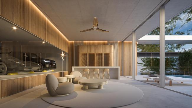 A massive glass ‘wall’ provides optimum viewing of a prized vehicle collection at a house on the Gold Coast. The vehicles can be seen from a private bar and the outdoor pool area. Picture: Joe Adsett Architects