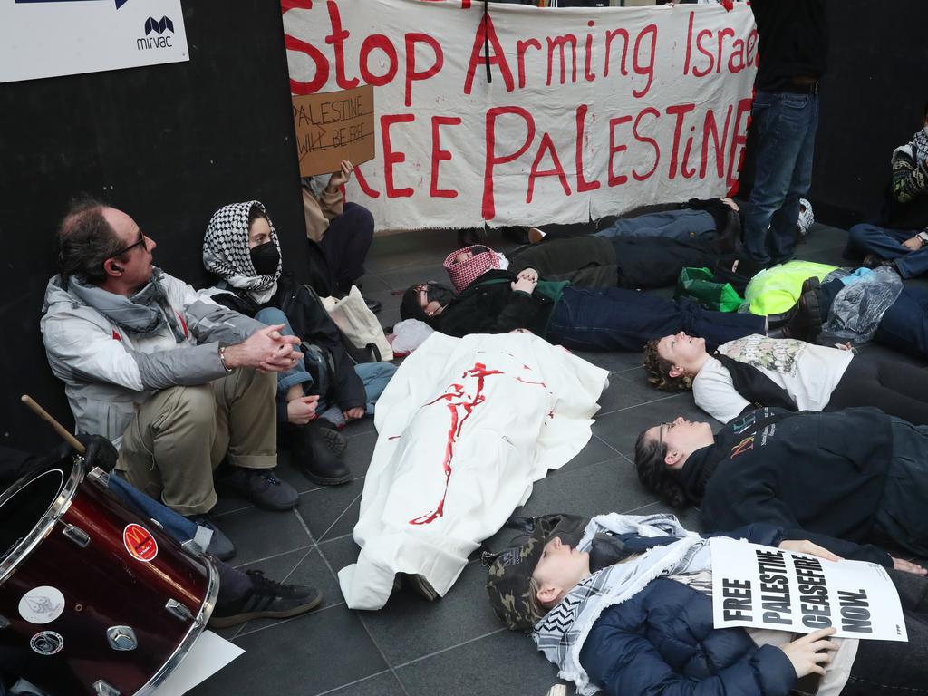 Protesters attempting to block the entryway to the conference in Melbourne on Friday. Picture: David Crosling / NewsWire