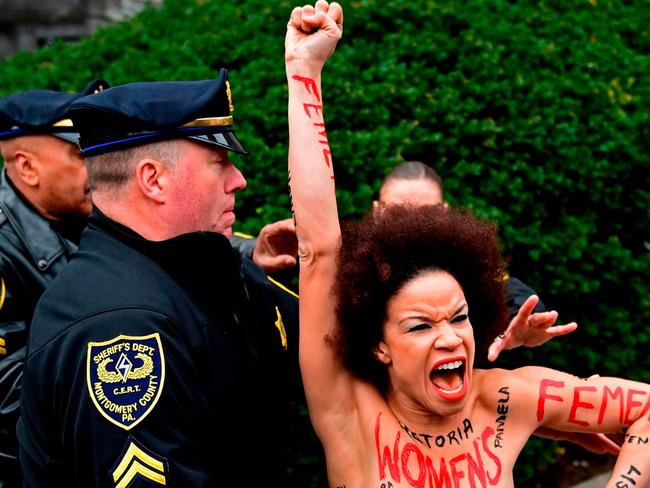 Actress Nicolle Rochelle, who appeared on several episodes of "The Cosby Show," is detained as Bill Cosby arrives for his sexual assault trial at the Montgomery County Courthouse. Picture: AP Photo/Corey Perrine, File.