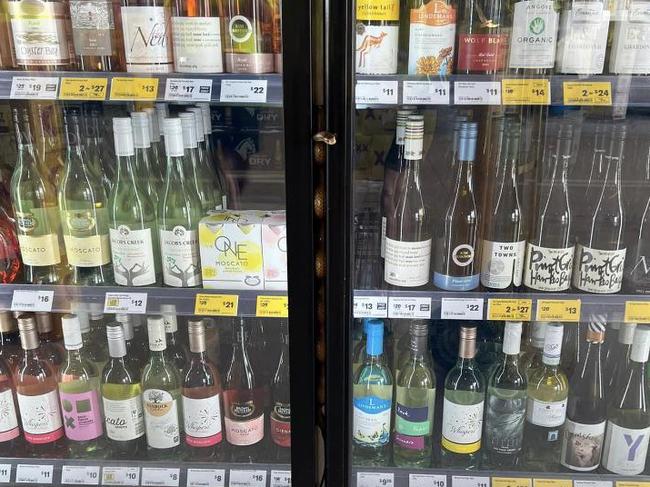 Snake in bottle shop wine fridge. Picture: Reddit