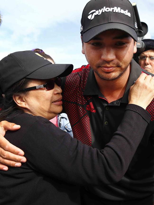 Jason hugged by Dening at the World Cup of Golf in 2013