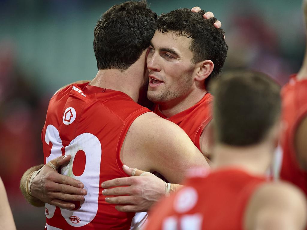 A bit of brotherly love in Paddy’s 50th. Picture: AFL Photos/Getty Images