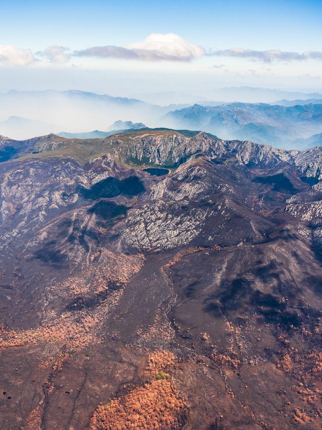 2019 Tasmanian bush fires. View towards Lake Rhona, Denison Range, Gell River Fire - at Southwest National Park. . Picture - LUKE TSCHARKE / PAR AVION