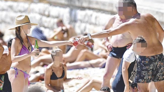 Beachgoers enjoying a drink within the regulated hours at East Esplanade. Picture: AAP IMAGE / Troy Snook