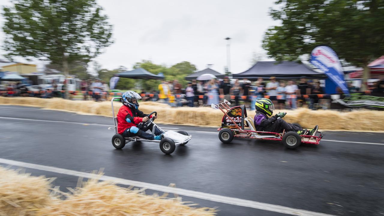 Lachlan Baumann (left) in hot pursuit of Kacey Czerwinski in a junior class of the Greenmount Billy Cart Challenge, Saturday, November 25, 2023. Picture: Kevin Farmer