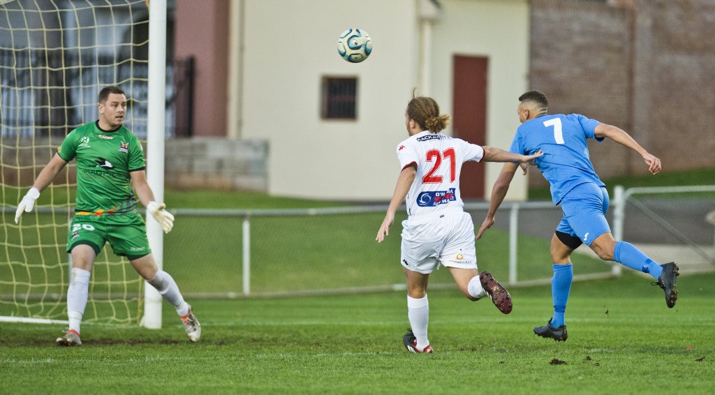 Travis Cooper, Thunder makes an attempt at goal. Picture: Nev Madsen