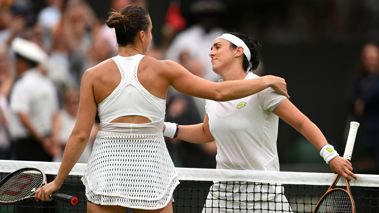 Ons Jabeur of Tunisia embraces Aryna Sabalenka as she celebrates victory following the Women's Singles Semi Finals on day eleven of The Championships Wimbledon 2023 at All England Lawn Tennis and Croquet Club .
