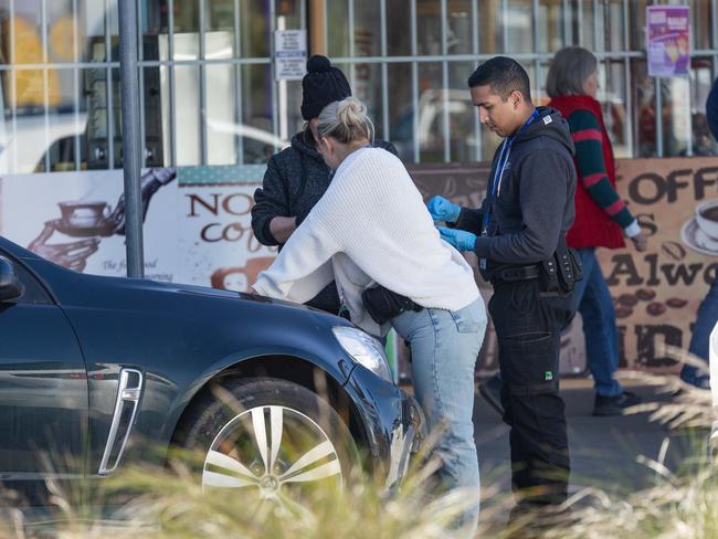 Police search a car in Shepparton. Picture: Jason Edwards