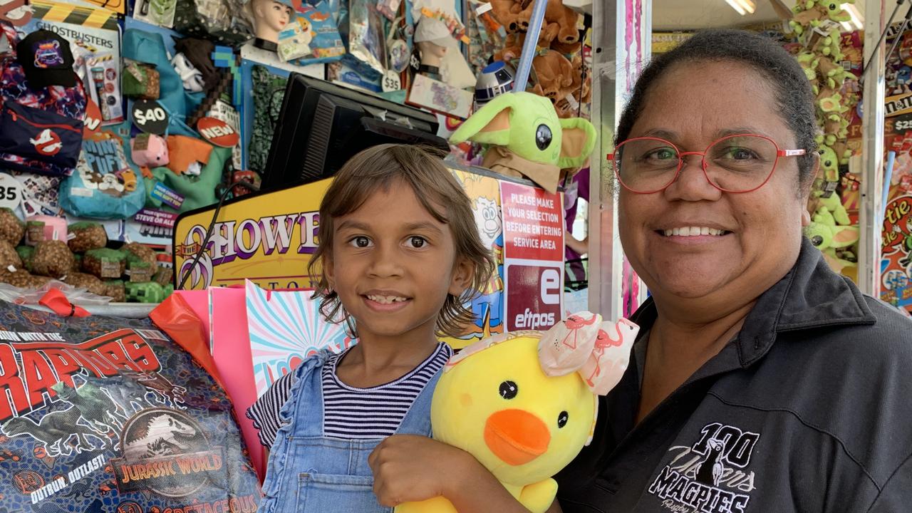 Rebecca Budby (right) with her niece Edith inspect the showbags at the Mackay Show on Thursday, June 16. Picture: Duncan Evans