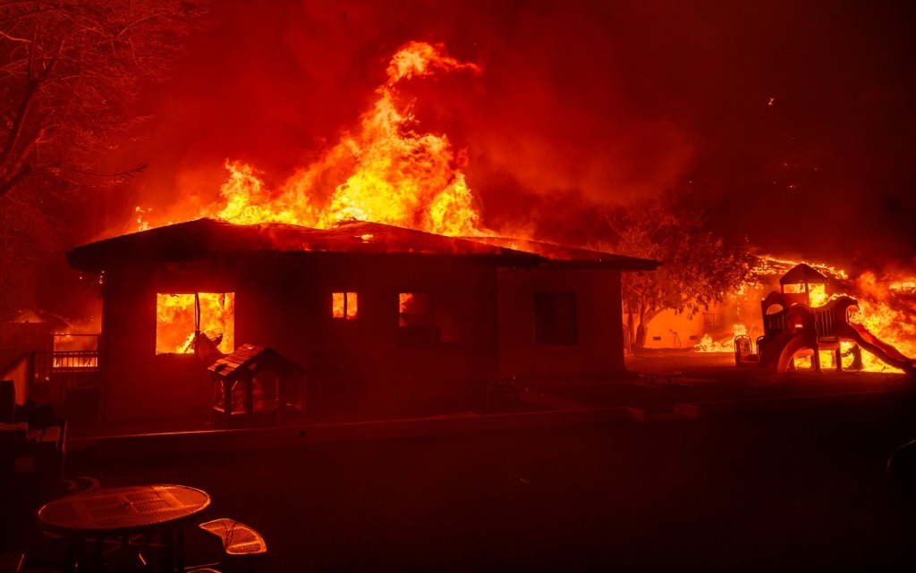 Wildfire sparks panicked evacuations in Los Angeles suburb