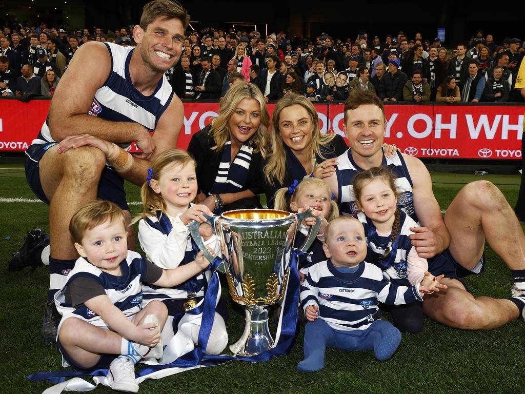 Tom Hawkins and Mitch Duncan with their families after the 2022 grand final win. Picture: Daniel Pockett/AFL Photos/via Getty Images