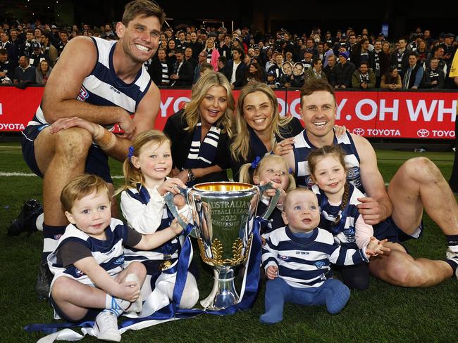 Tom Hawkins and Mitch Duncan with their families after the 2022 grand final win. Picture: Daniel Pockett/AFL Photos/via Getty Images