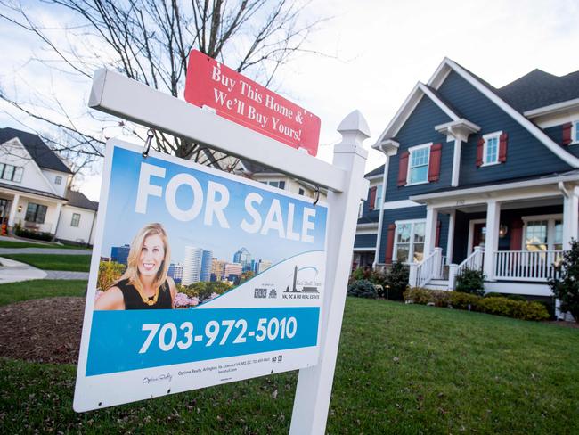 (FILES) In this file photo taken on November 21, 2020 A house is for sale in Arlington, Virginia, November 19, 2020. - The hot US housing market continued in January as sales of existing homes rose again, but high demand drove supply to a record low, according to industry data released on February 19, 2021. Home sales have remained solid, consistently one of the strongest sectors of the pandemic-ravaged US economy, fueled by record low borrowing costs, even as builders have struggled to keep up with demand. (Photo by SAUL LOEB / AFP)