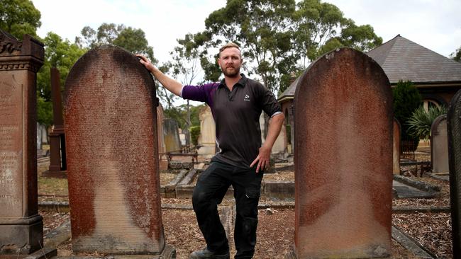 Stonemason Matthew Johnson at Rookwood Cemetery, near Lidcombe. Picture: AAP/ Justin Sanson