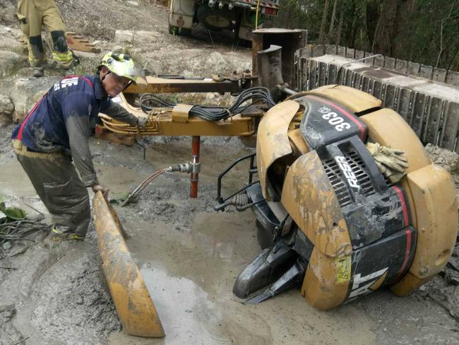 The excavator being removed from the dam. Picture: Facebook/ Fire and Rescue 295 Forster