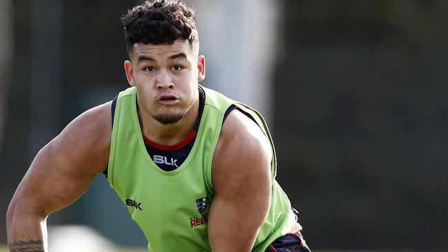 Rebels player Hunter Paisami looks to pass during training in Melbourne.