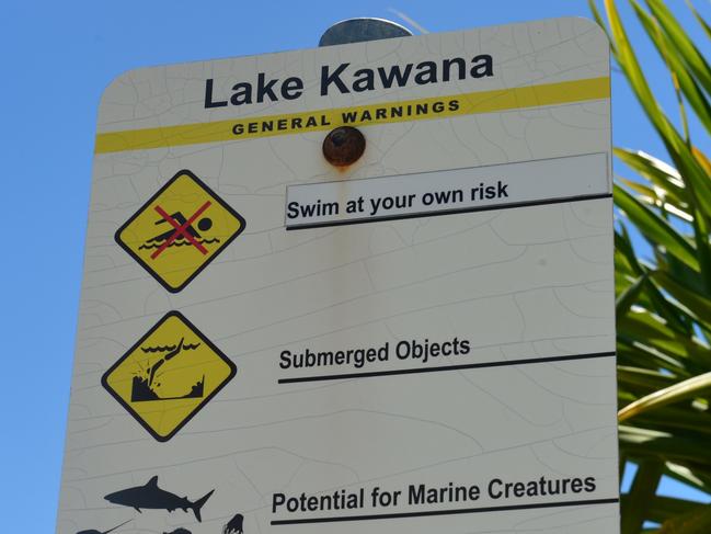 BULL SHARKS: A council sign at Lake Kawana warning of sharks.