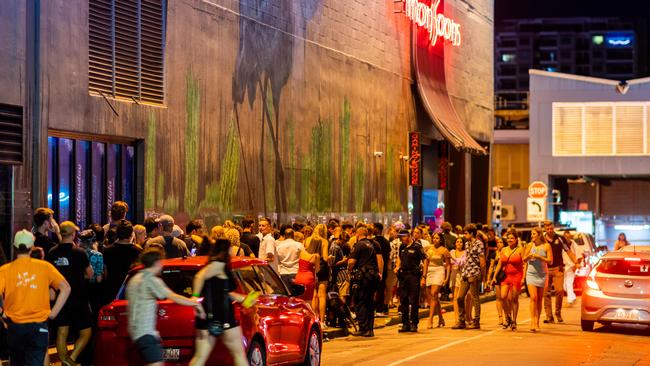 Party crowds line up outside Monsoons in Mitchell Street to celebrate the end of 2020. Picture: Che Chorley