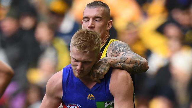 Dustin Martin copped fines for incidents with Nick Robertson and Lewis Taylor.