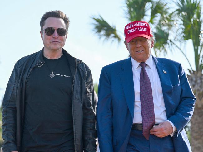 BROWNSVILLE, TEXAS - NOVEMBER 19: U.S. President-elect Donald Trump greets Elon Musk as he arrives to attend a viewing of the launch of the sixth test flight of the SpaceX Starship rocket on November 19, 2024 in Brownsville, Texas. SpaceXâs billionaire owner, Elon Musk, a Trump confidante, has been tapped to lead the new Department of Government Efficiency alongside former presidential candidate Vivek Ramaswamy.   Brandon Bell/Getty Images/AFP (Photo by Brandon Bell / GETTY IMAGES NORTH AMERICA / Getty Images via AFP)