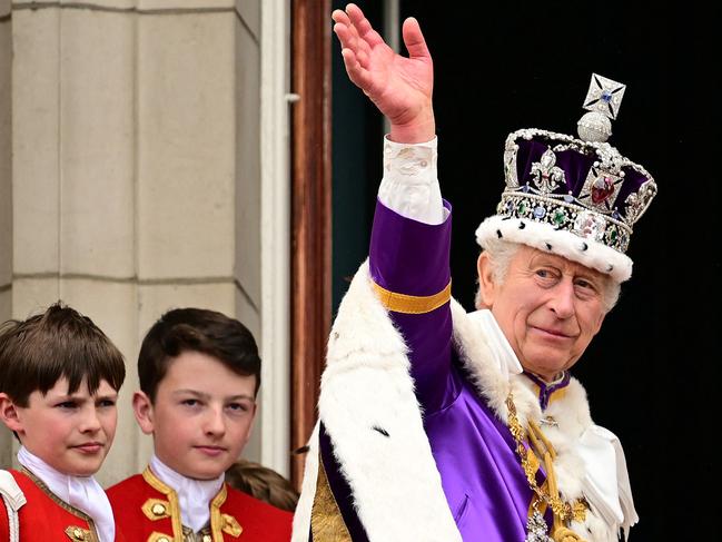 King Charles III waves from the Buckingham Palace balcony following his coronation in May. He has already been forced to contend with his own “annus horribilis”. Picture: Leon Neal/Pool/AFP