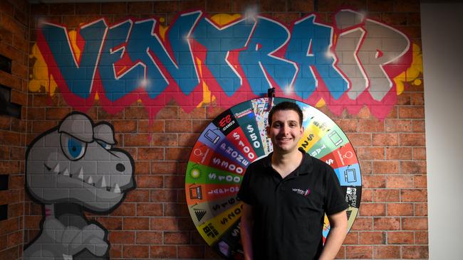 VentraIP chief executive Angelo Giuffrida in front of the wheel of prizes. Picture: Penny Stephens