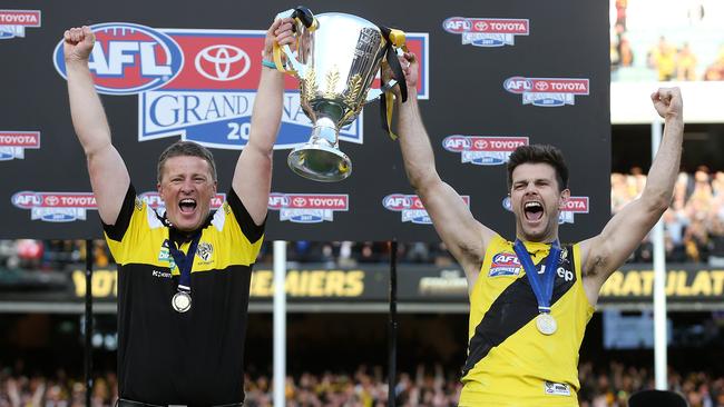 Richmond coach Damien Hardwick and captain Trent Cotchin hold the cup aloft. Picture: Michael Klein