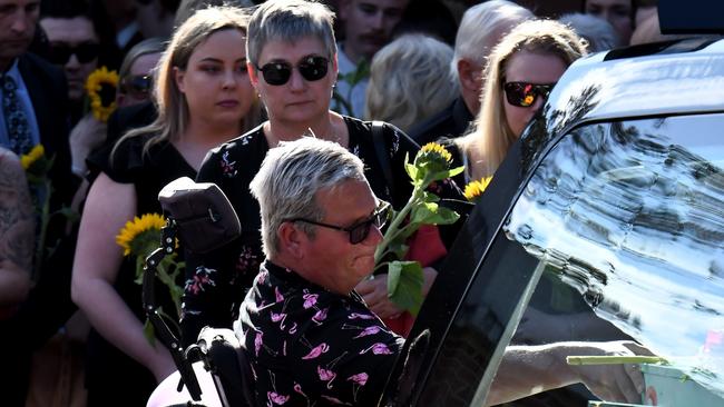 John Van de Putte palces a hand on his daughter’s coffin at her funeral. Picture: Chris Dyson