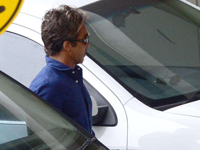 John Ibrahim arrives at St Vincent’s Hospital after the shooting of his brother Michael last night. Picture: Jeremy Piper