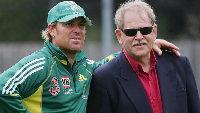 Warne of Australia stands with mentor Terry Jenner during training at Bellerive Oval on November 15, 2005 in Hobart, Australia. Photo by Hamish Blair/Getty Images.